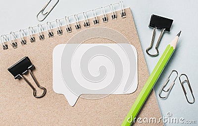 Notepad, white sticker and pensil on the desk. Mock up in copy space office background. It is important not to forget the note Stock Photo