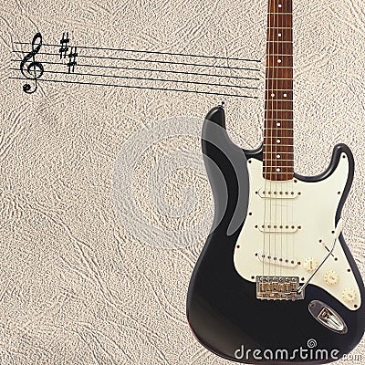 Notes and solid body classic electric guitar on right side of the light skin background. Stock Photo