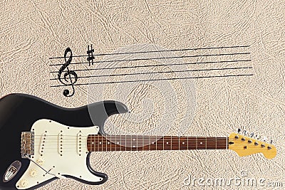 Notes stave and solid body classic electric guitar at bottom of the light skin background. Stock Photo