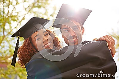 Nothing beats the feeling of hard earned achievement. happy university students on graduation day. Stock Photo