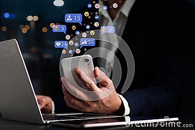 The notion of social media and digital internet, A guy uses his smartphone to access social media. The notion of work and play, as Stock Photo