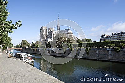 Notre Dame cathedral, Paris along the river Seine. Editorial Stock Photo
