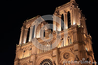 Notre Dame Cathedral in Paris and its lighting at night Stock Photo
