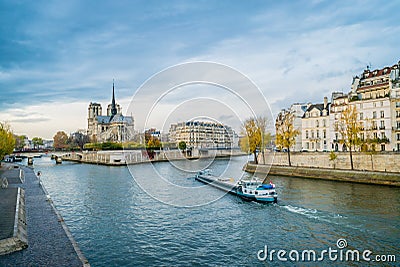 Notre-dame-de-Paris, the Seine river and a boat Stock Photo