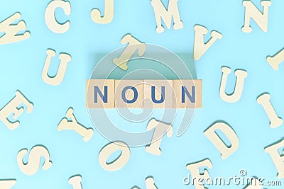 Noun or nouns concept in English grammar and learning class lesson. Wooden blocks typography word flat lay Stock Photo