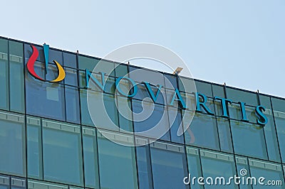 Novartis sign hanging at the building in Rotkreuz, Switzerland Editorial Stock Photo