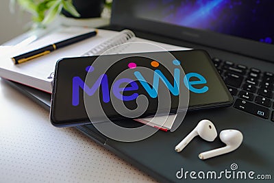 November 22, 2022, Brazil. In this photo illustration, the MeWe logo is displayed on a smartphone screen Cartoon Illustration