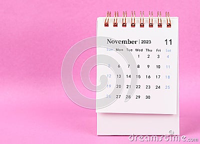 The November 2023 desk calendar on pink color background Stock Photo