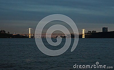 November 11, 2017, The Hudson River, Near Inwood Park, New York City. The Brightly Lit Towers of The George Washington Bridge Can Stock Photo