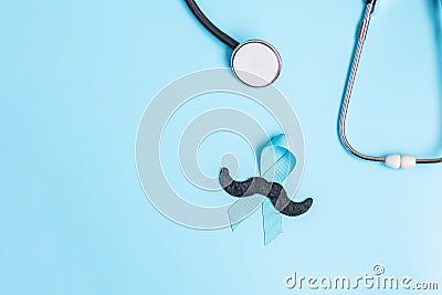 November Prostate Cancer Awareness, light Blue Ribbon with stethoscope and mustache for supporting people living and illness. Men Stock Photo