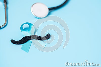 November Prostate Cancer Awareness, light Blue Ribbon with stethoscope and mustache for supporting people living and illness. Men Stock Photo