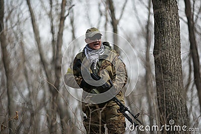 Active military exercises in the forest. Shootout army in the autumn forest. Training airsoft teams in Russia. Editorial Stock Photo