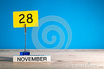 November 28th. Day 28 of november month, calendar on workplace with blue background. Autumn time. Empty space for text Stock Photo