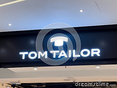 Novi Sad, Serbia - January 28, 2023: Brand logo sign of Tom Tailor store in Promenada shopping mall in Novi Sad, Serbia Editorial Stock Photo