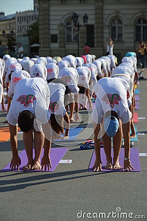 People participate in a yoga event in the center of the city Editorial Stock Photo