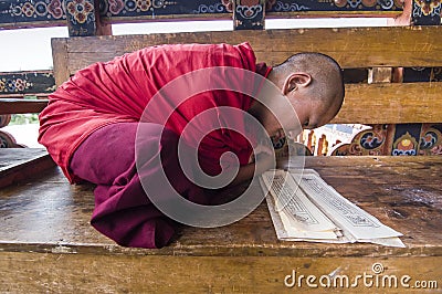 novice monk of Punakha Dzong , Bhutan , during chanting mantra Editorial Stock Photo