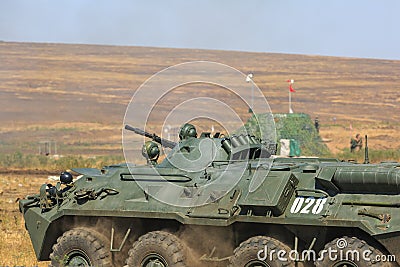 NOVOCHERKASSK, RUSSIA, 26 AUGUST 2017: Russian armored personnel carrier rides in the military firing range Editorial Stock Photo