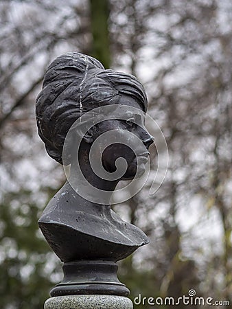 Novodevichy cemetery in Moscow, grave, sculpture, face in stone, fine art Editorial Stock Photo