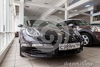 Front view of the 2006 sport porsche boxster s sedan prepared for sale and exhibited in the showroom with a polished shiny black Editorial Stock Photo