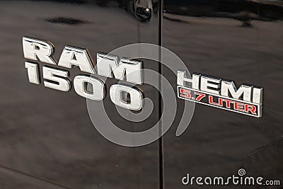 Black Dodge Ram with an engine of 5.7 liters front fender view with emblem 1500 Hemi on the car parking with snow background Editorial Stock Photo