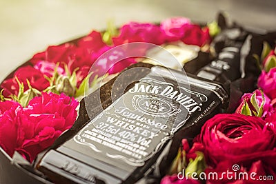 NOVOSIBIRSK, RUSSIA - FEBRUARY 23, 2018 - gift wrapping of JackDaniels whiskey. Cubes from Belgian white chocolate. Editorial Stock Photo