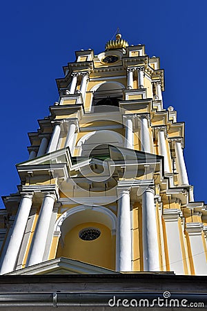 Novospassky monastery in Moscow. Yellow belfry decorated by white columns Stock Photo