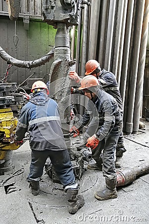 Men`s work while drilling oil and gas wells. Editorial Stock Photo