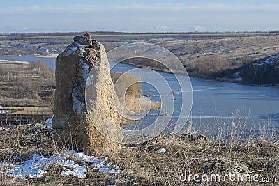 Novyi Buh, Mykolaiv region, Ukraine - March 9, 2021: Granite rocks on the winter banks of the river Ingul, Ukraine Editorial Stock Photo