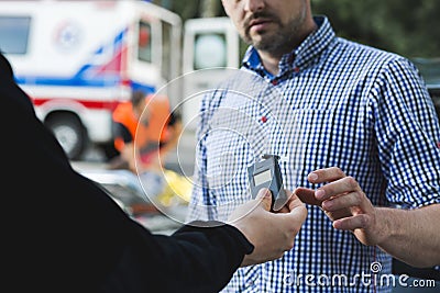 Now blow in the drunkometer Stock Photo