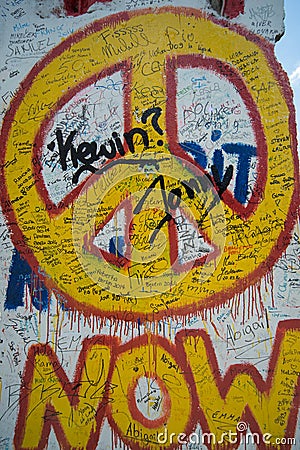 Now peace graffiti sign on the Berlin wall Editorial Stock Photo