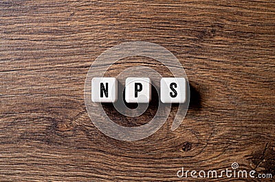 NPS - Net Promoter Score, word written on cubes, text Stock Photo