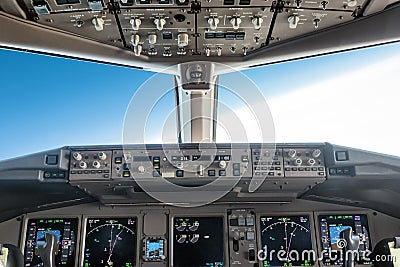 Nside a big jet flying plane cockpit Stock Photo