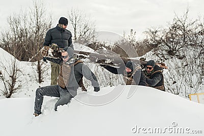 Nstructor and army soldiers have training with huge chump wood Stock Photo