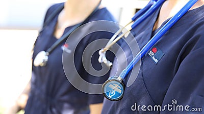 NSW Government Health worker wearing navy blue uniform and stethoscope Editorial Stock Photo