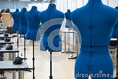 Nterior of garment factory shop. Closes making atelier with several sewing machines. Stock Photo