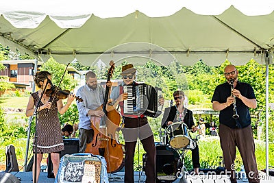 Nu Klezmer Army, musical group rocking their instruments Editorial Stock Photo