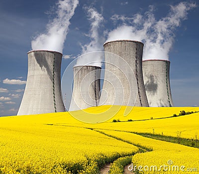 Nuclear power plant Dukovany with golden flowering field Stock Photo