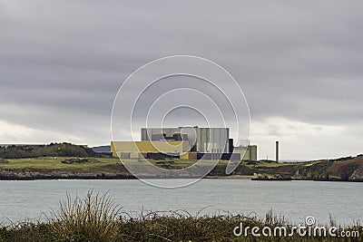 Nuclear power station seen from across bay Stock Photo