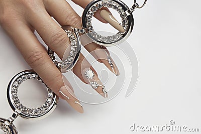 Nude manicure with rhinestones. Stock Photo