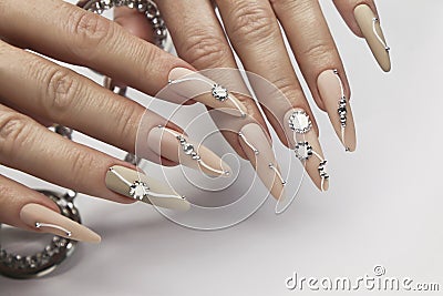 Nude manicure with rhinestones. Stock Photo