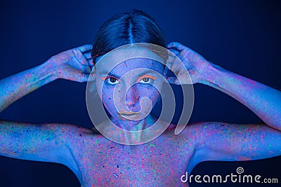 nude woman in glowing neon paint Stock Photo