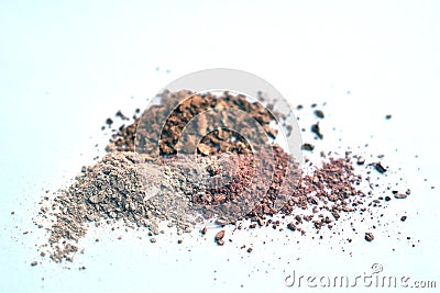 Nudes eyeshadows broken on a white surface Stock Photo