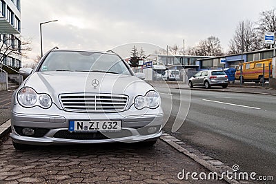 Mercedes Benz car stands on a parking stripe Editorial Stock Photo
