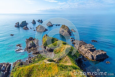 The nuggets - rocky islets at Nugget point in New Zealand Stock Photo
