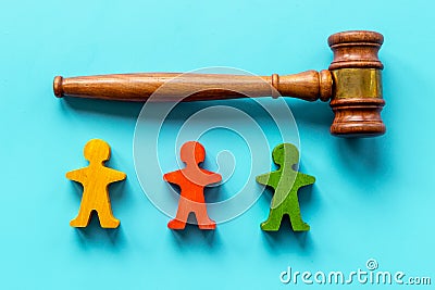 Numan wooden figurines with judge gavel. Resolving conflict situation Stock Photo