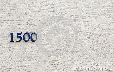 The number 1500 against a stucco wall Stock Photo
