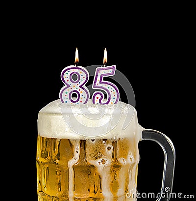 Number 85 candle in beer Stock Photo