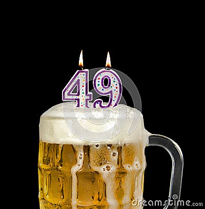 Number 49 candle in beer froth Stock Photo