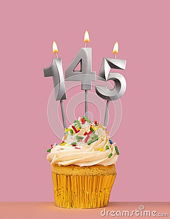Number 145 candle with cupcake - Birthday card Stock Photo