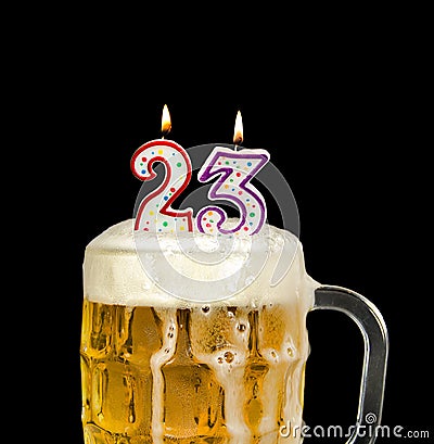 Number 23 candle in beer mug Stock Photo